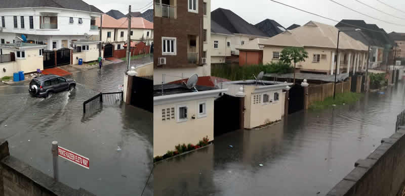 Flooded residential street in Lagos showing submerged houses, vehicles, and poor drainage infrastructure.
